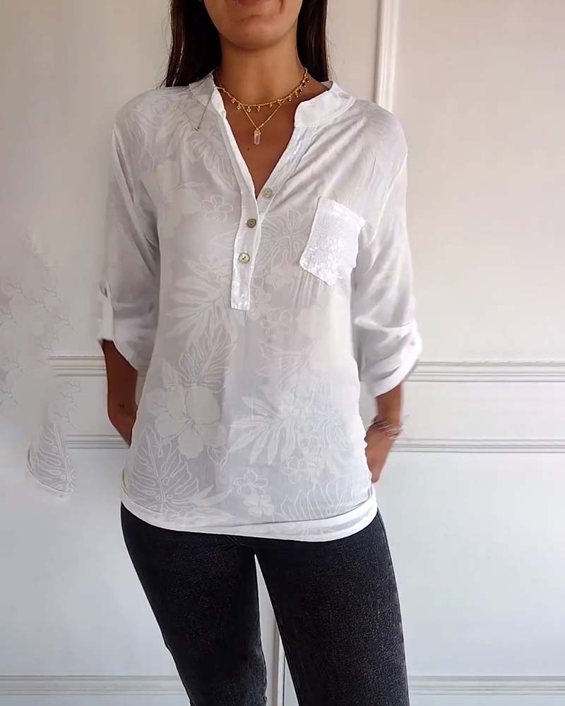 Top met bladprint en patchwork-pailletten