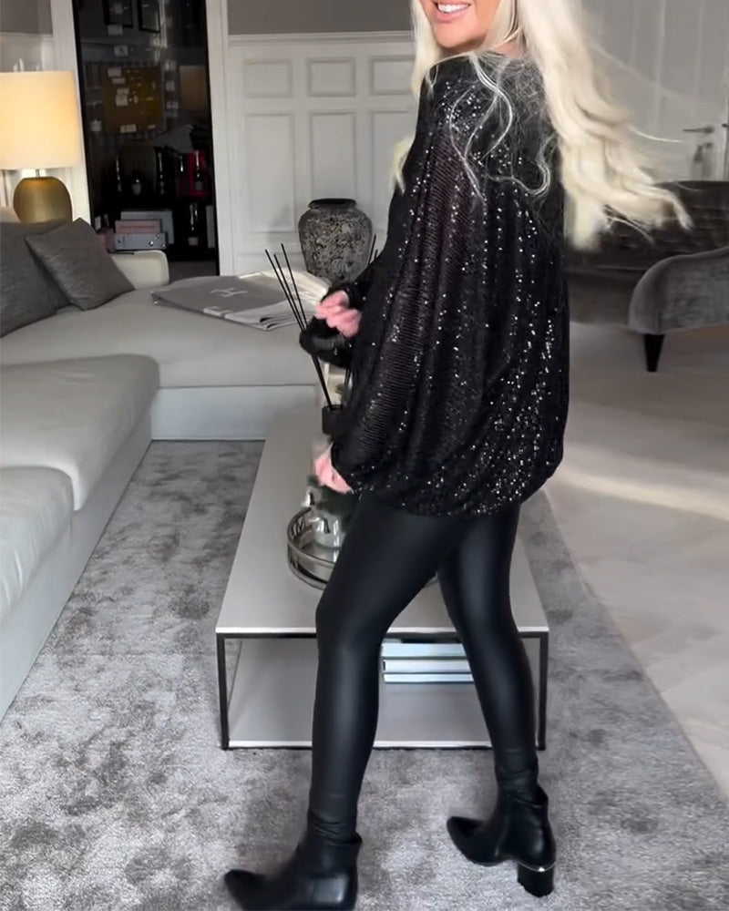 Top met ronde hals en ballonmouwen en pailletten