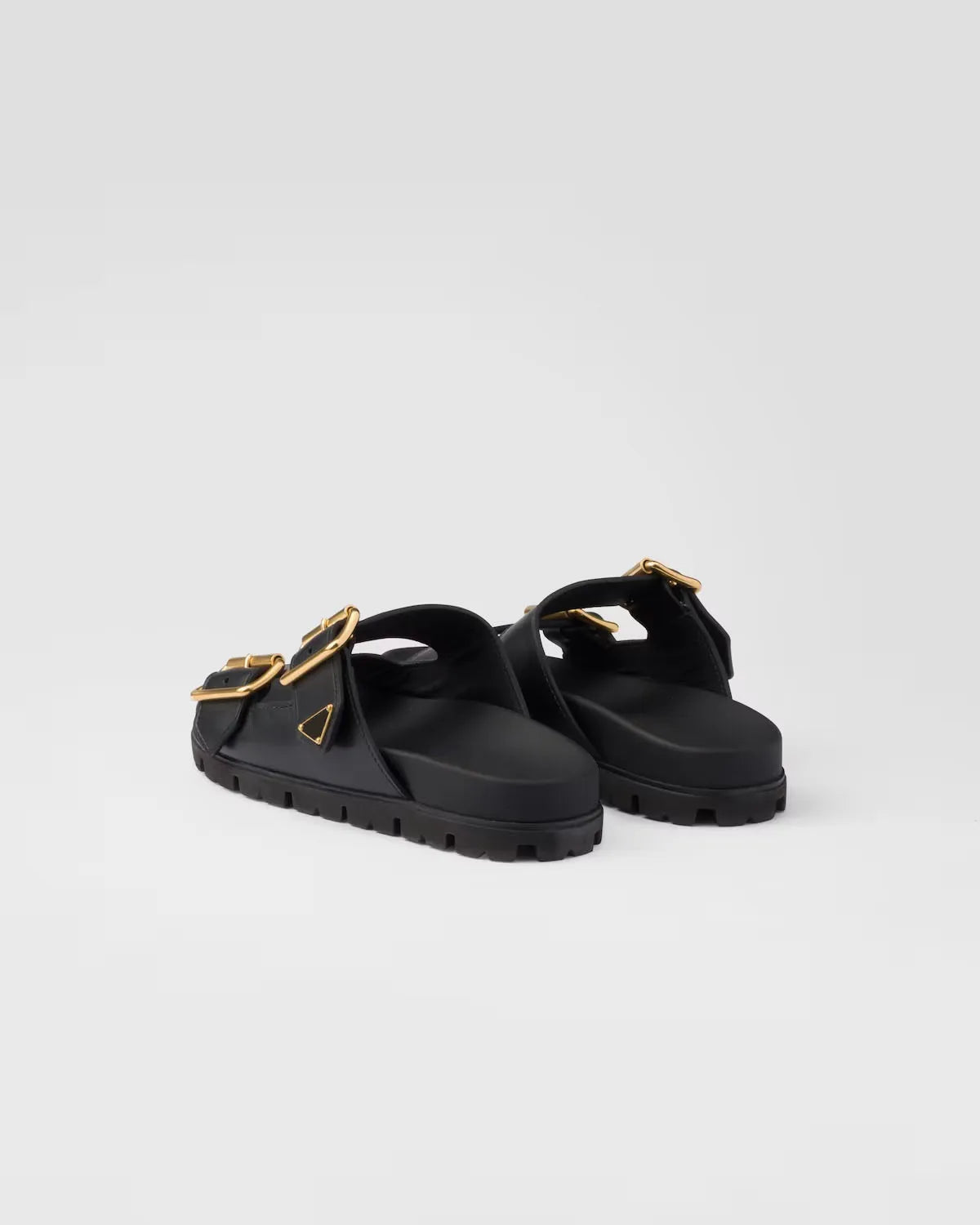 Zwarte slide sandalen met gouden gespen
