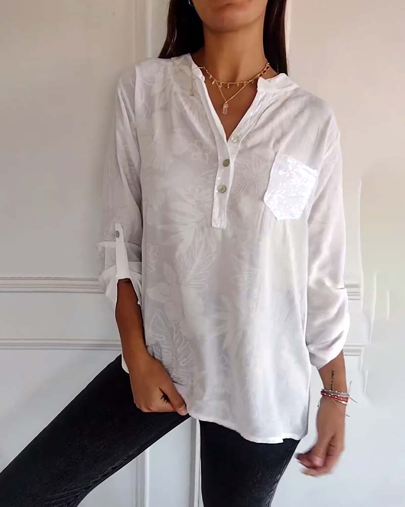 Top met bladprint en patchwork-pailletten