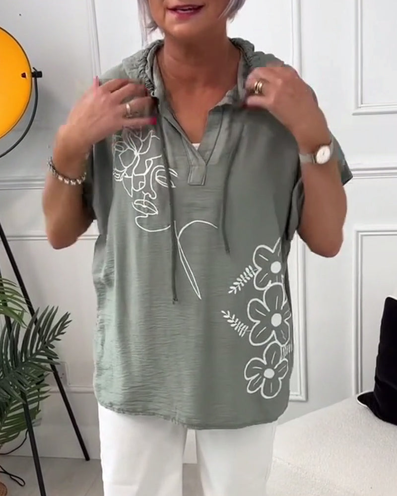 Casual blouse met korte mouwen en bloemenprint met capuchon