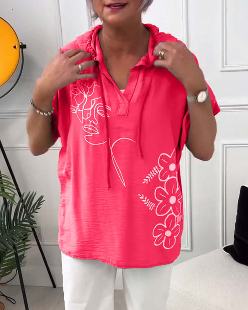 Casual blouse met korte mouwen en bloemenprint met capuchon