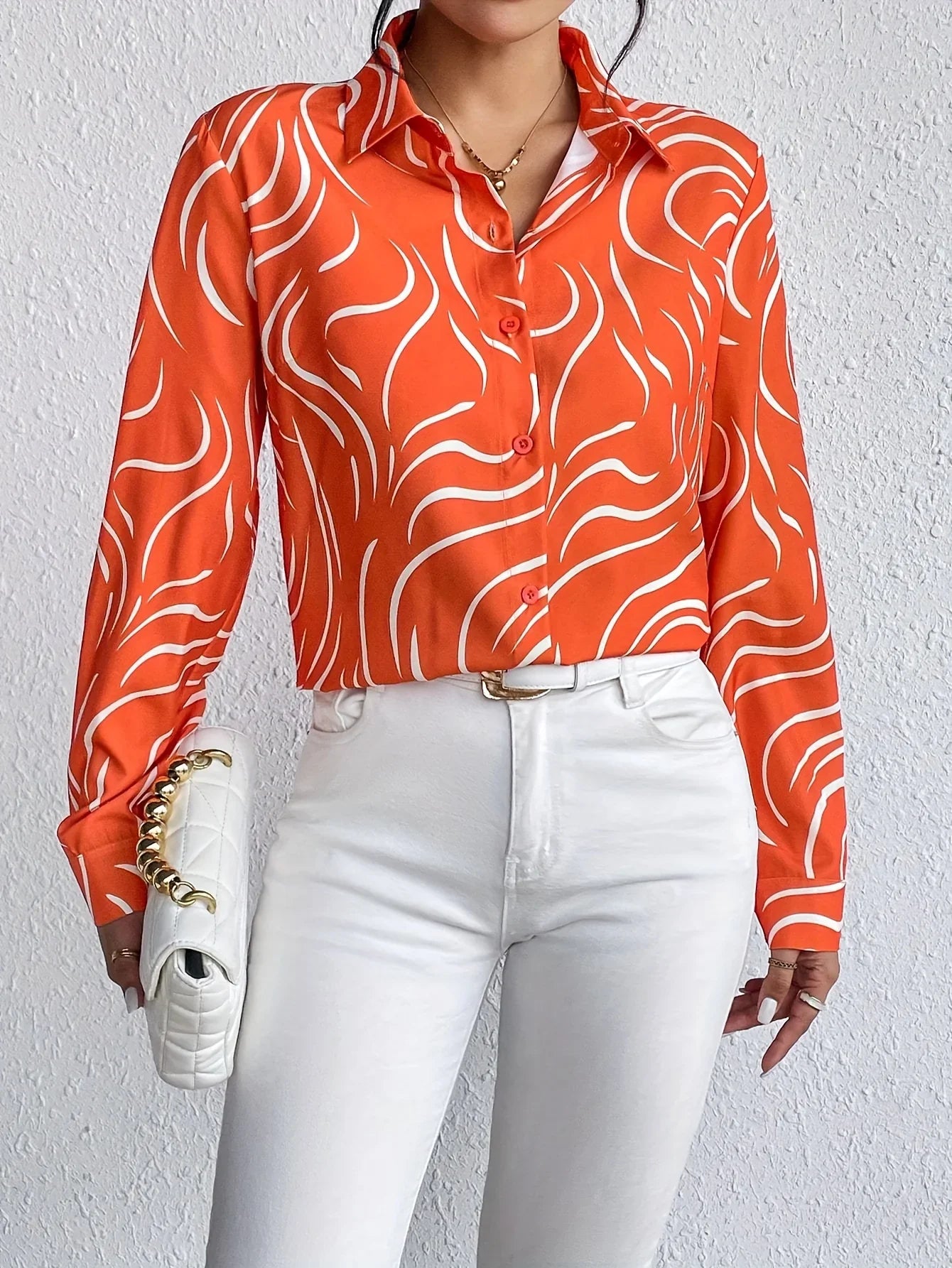 Oranje blouse met abstracte print
